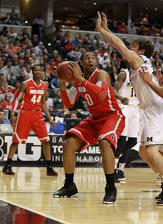 Tim Hardaway Jr. (10) and Evan Smotrycz (23)