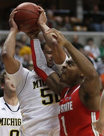 Zack Novak (0) and Jordan Morgan (52)