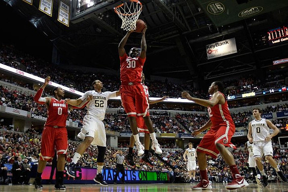 Jordan Morgan (52), Matt Vogrich (13), Zack Novak (0), and Tim Hardaway Jr. (10)