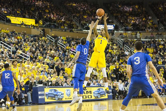 Charles Matthews (1) and Jordan Poole (2)