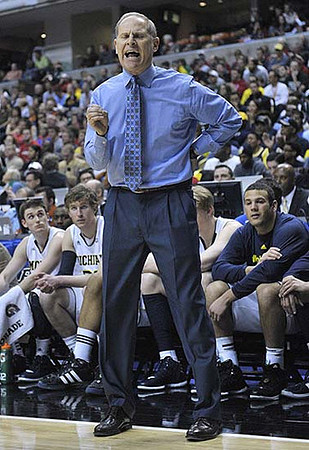 Stu Douglass (1), Evan Smotrycz (23), John Beilein, Blake McLimans (22), and Josh Bartelstein (20)