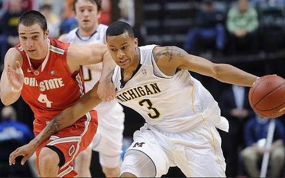 Zack Novak (0) and Trey Burke (3)