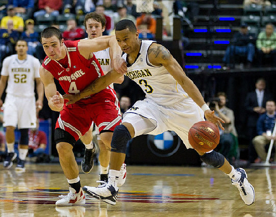 Jordan Morgan (52), Zack Novak (0), and Trey Burke (3)