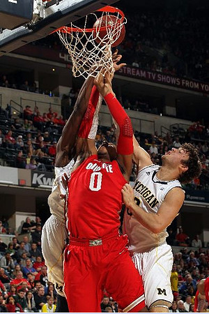 Tim Hardaway Jr. (10) and Zack Novak (0)