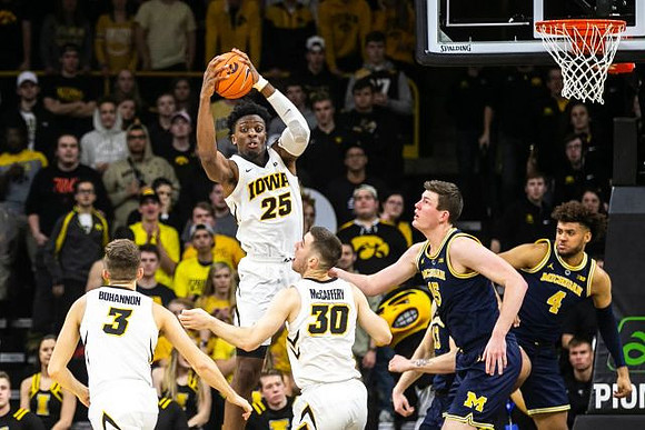 Jon Teske (15) and Isaiah Livers (4)