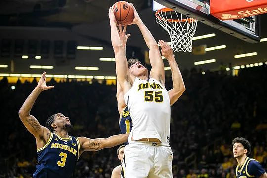 Zavier Simpson (3), Ignas Brazdeikis (13), and Brandon Johns Jr. (23)