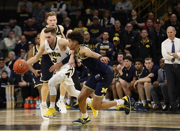 Ignas Brazdeikis (13), Jordan Poole (2), and John Beilein