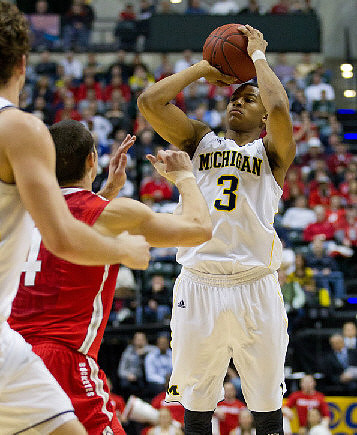 Zack Novak (0) and Trey Burke (3)