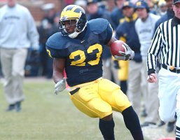 Chris Perry (23), Erik Campbell, and Lloyd Carr
