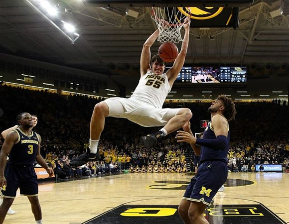 Zavier Simpson (3) and Isaiah Livers (4)