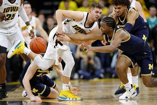 Ignas Brazdeikis (13), Zavier Simpson (3), and Isaiah Livers (4)