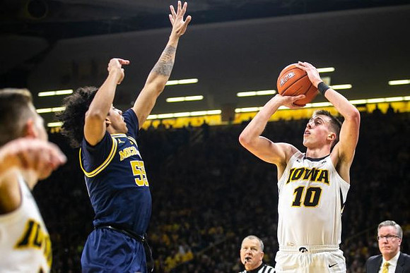 Eli Brooks (55) and Iowa Head Coach Fran McCaffery