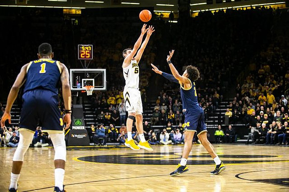 Charles Matthews (1) and Jordan Poole (2)