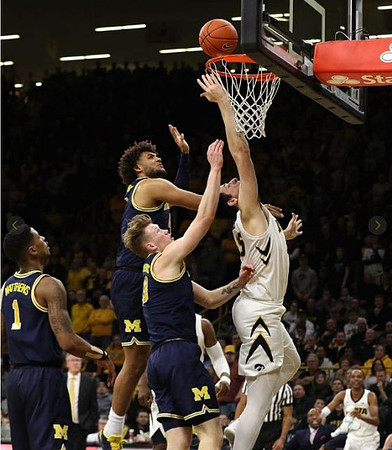 Charles Matthews (1), Isaiah Livers (4), and Ignas Brazdeikis (13)