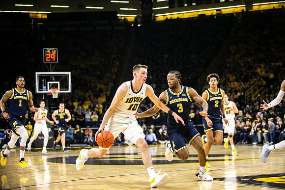 Charles Matthews (1), Austin Davis (51), Zavier Simpson (3), and Jordan Poole (2)