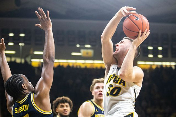 Zavier Simpson (3), Isaiah Livers (4), and Ignas Brazdeikis (13)