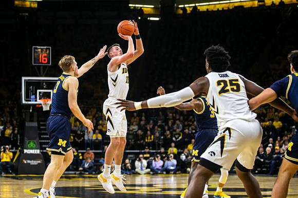 Ignas Brazdeikis (13) and Zavier Simpson (3)