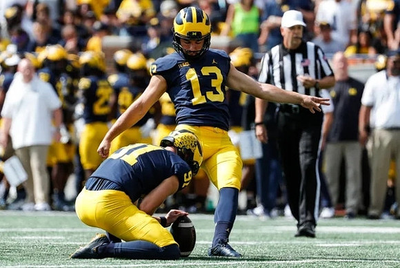 Brad Robbins (91), and Jake Moody (13)