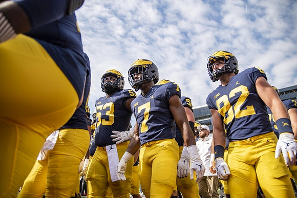 Trente Jones (53), Donovan Edwards (7), and Max Bredeson (82)