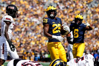 Hassan Haskins (25), and Cornelius Johnson (6)