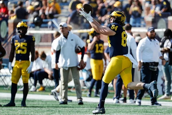 Hassan Haskins (25), and Joel Honigford (84)