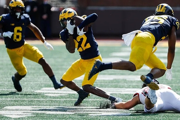 Cornelius Johnson (6), Tavierre Dunlap (22), and Hassan Haskins (25)