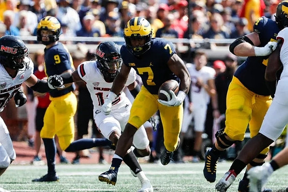 J.J. McCarthy (9), Donovan Edwards (7), and Reece Atteberry (74)