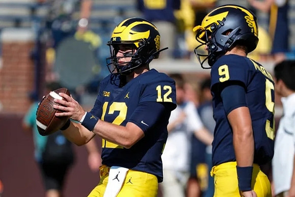 Cade McNamara (12), and J.J. McCarthy (9)
