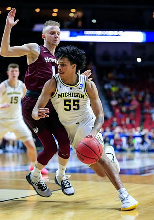 Eli Brooks (55) and Jon Teske (15)