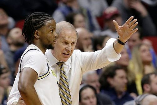Zavier Simpson (3) and John Beilein