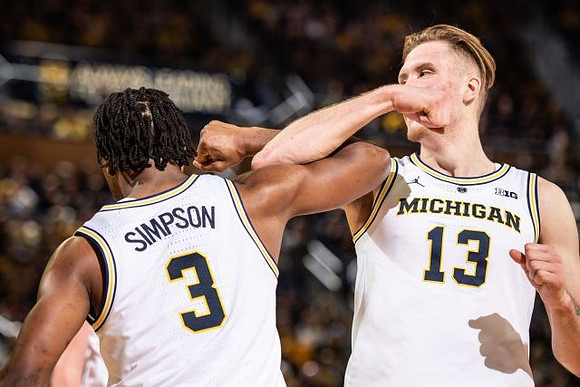 Zavier Simpson (3) and Ignas Brazdeikis (13)