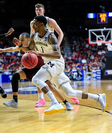 Charles Matthews (1) and Jon Teske (15)