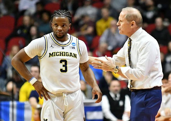 Zavier Simpson (3) and John Beilein