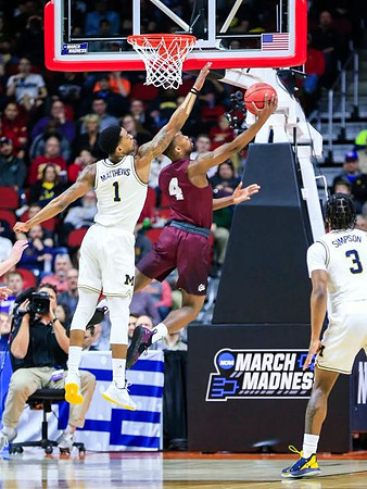 Charles Matthews (1) and Zavier Simpson (3)