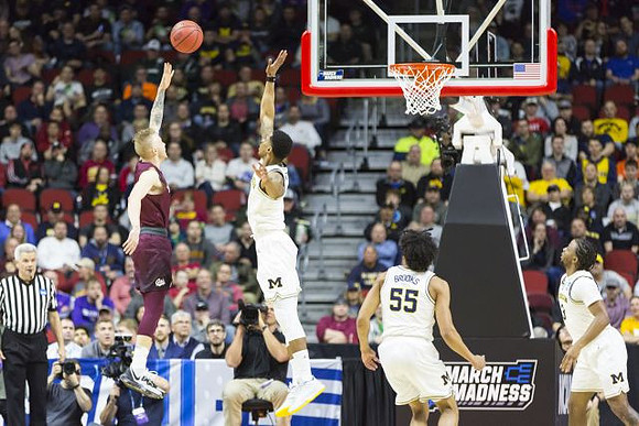 Charles Matthews (1), Eli Brooks (55), and Zavier Simpson (3)