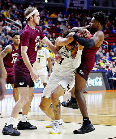 Isaiah Livers (4) and Zavier Simpson (3)