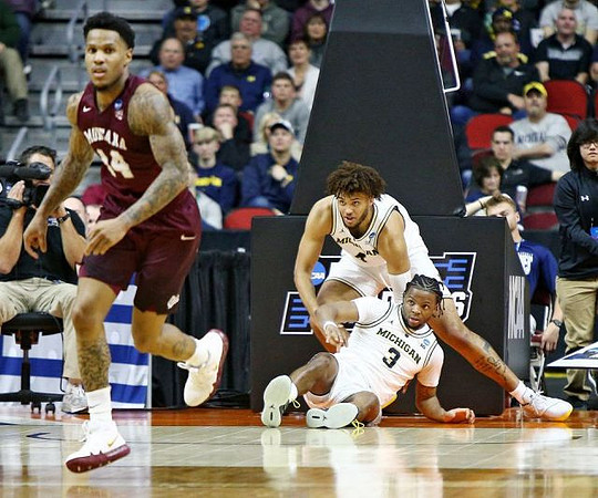 Zavier Simpson (3) and Isaiah Livers (4)