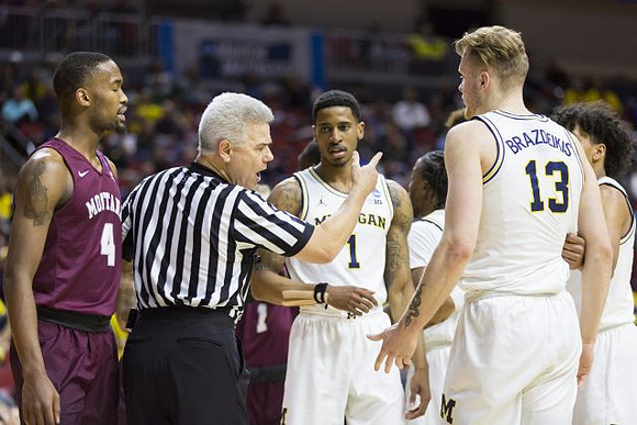 Charles Matthews (1), Ignas Brazdeikis (13), Zavier Simpson (3), and Eli Brooks (55)