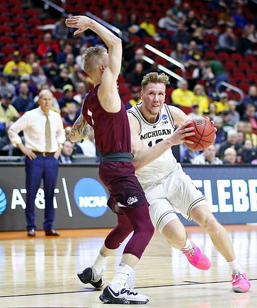 Ignas Brazdeikis (13) and John Beilein