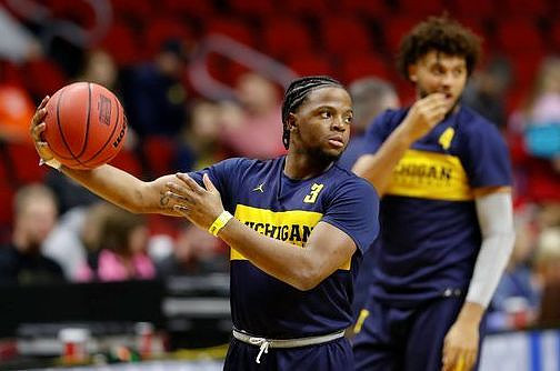 Zavier Simpson (3) and Isaiah Livers (4)