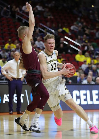 Ignas Brazdeikis (13) and John Beilein