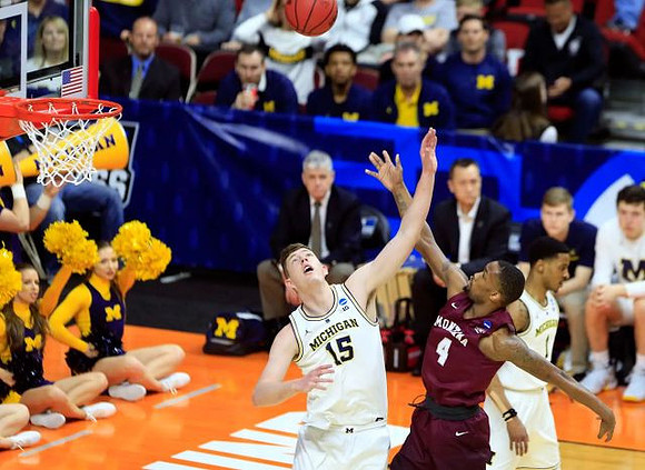 Jon Teske (15) and Charles Matthews (1)