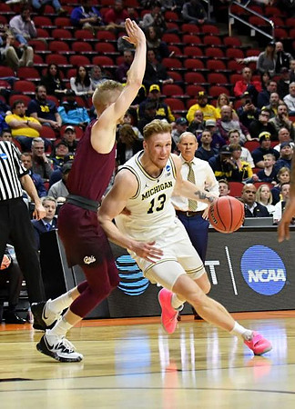 Ignas Brazdeikis (13) and John Beilein