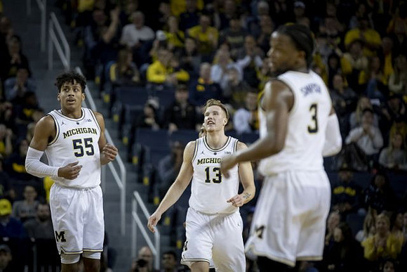Eli Brooks (55), Ignas Brazdeikis (13), and Zavier Simpson (3)