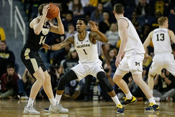 Charles Matthews (1), Jon Teske (15), and Ignas Brazdeikis (13)