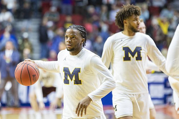 Zavier Simpson (3) and Isaiah Livers (4)