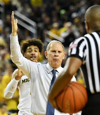 Jordan Poole (2) and John Beilein