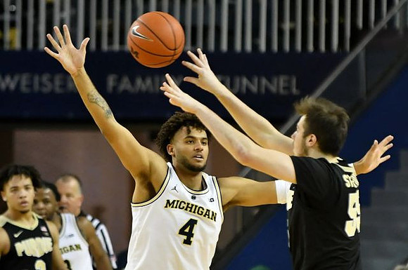 Zavier Simpson (3) and Isaiah Livers (4)