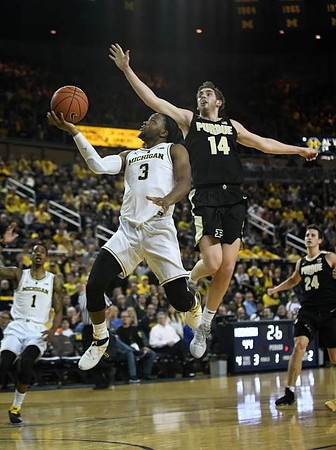 Charles Matthews (1) and Zavier Simpson (3)