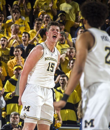 Jon Teske (15) and Jordan Poole (2)